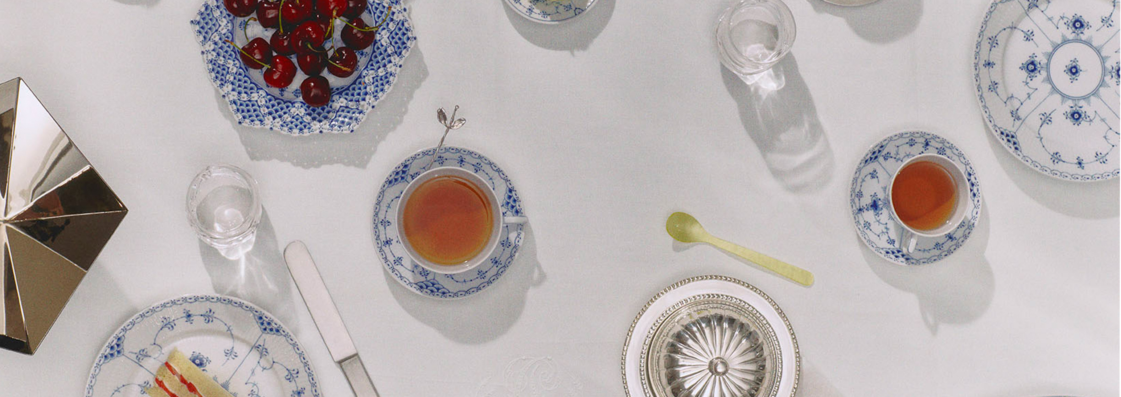An elegant table set with Blue Fluted Full Lace and Blue Fluted Half Lace